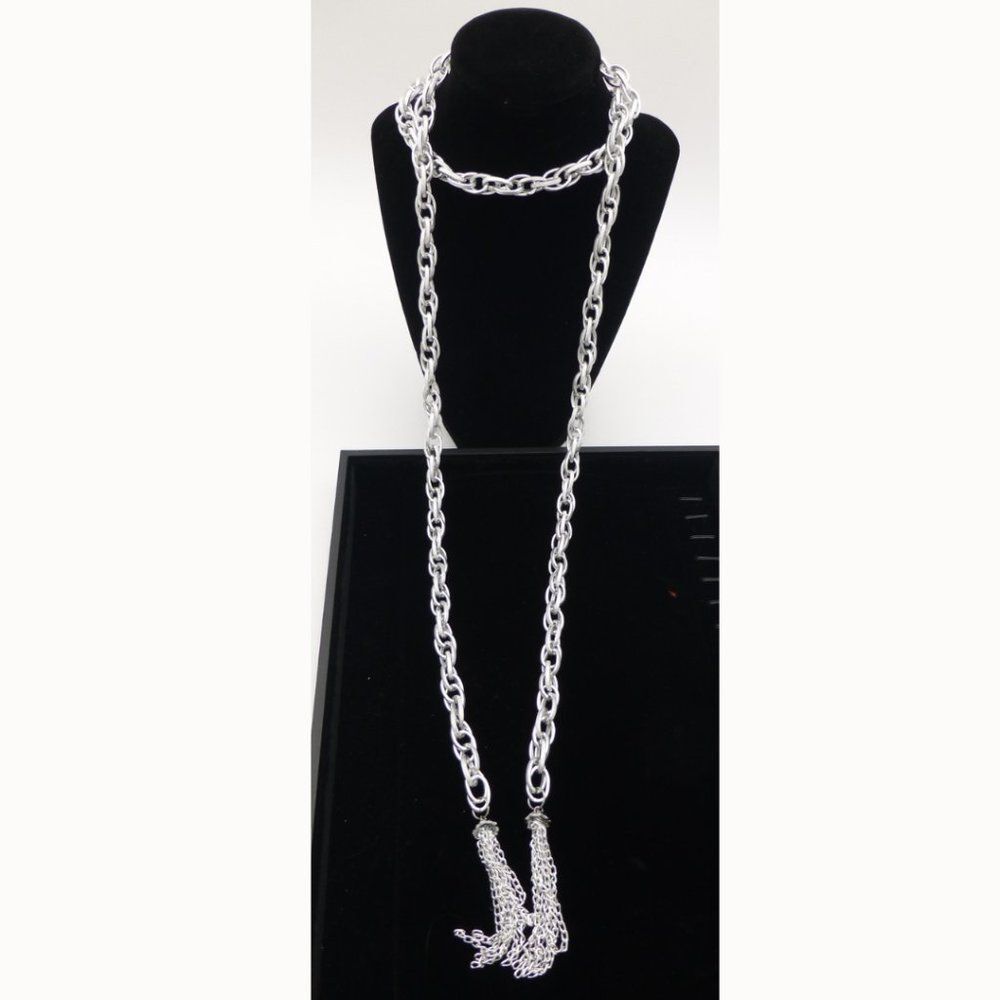 New In Package. Necklace and Earring Set: Silver-Tone Open Ended Tassel Necklace